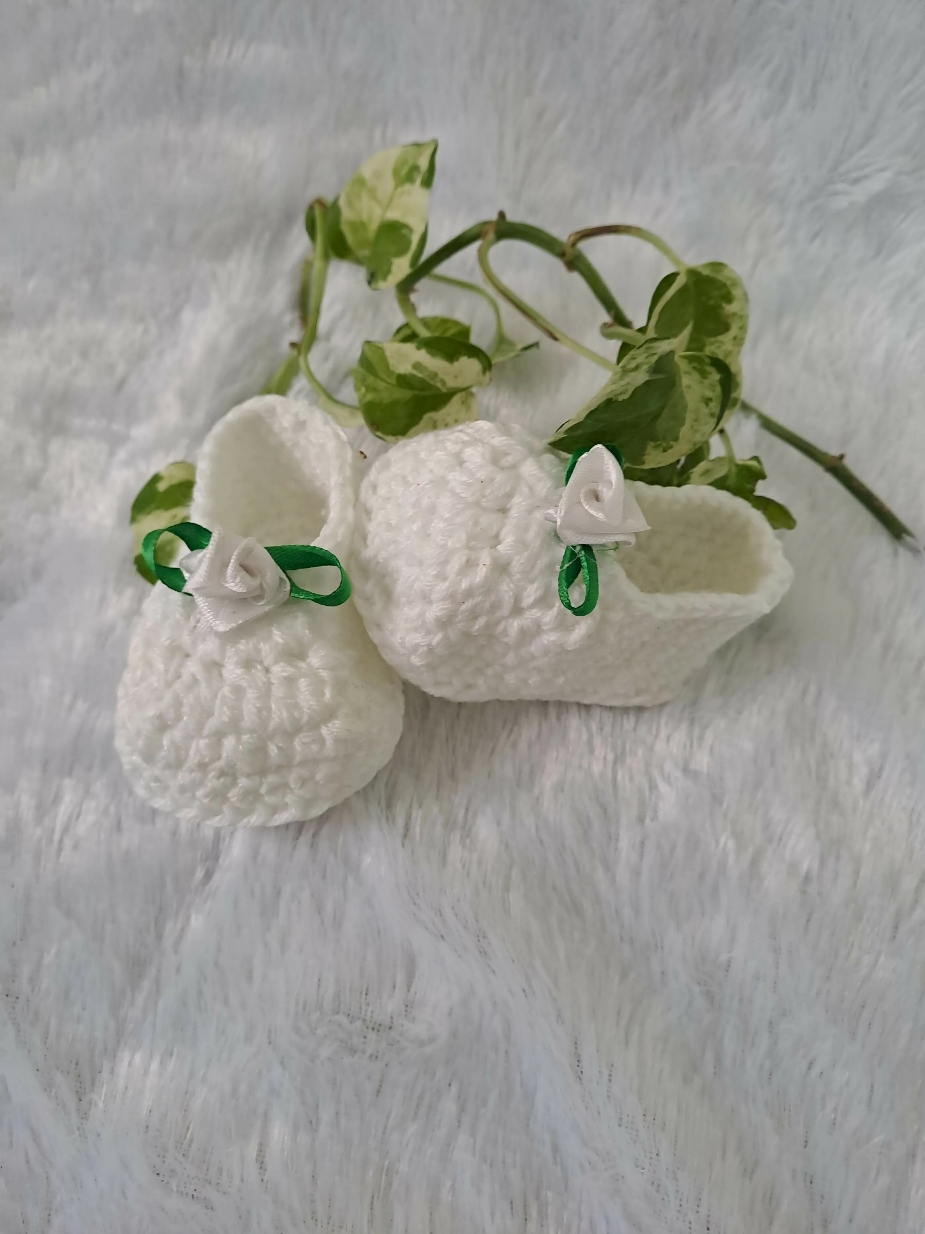 Crochet baby girl booties.