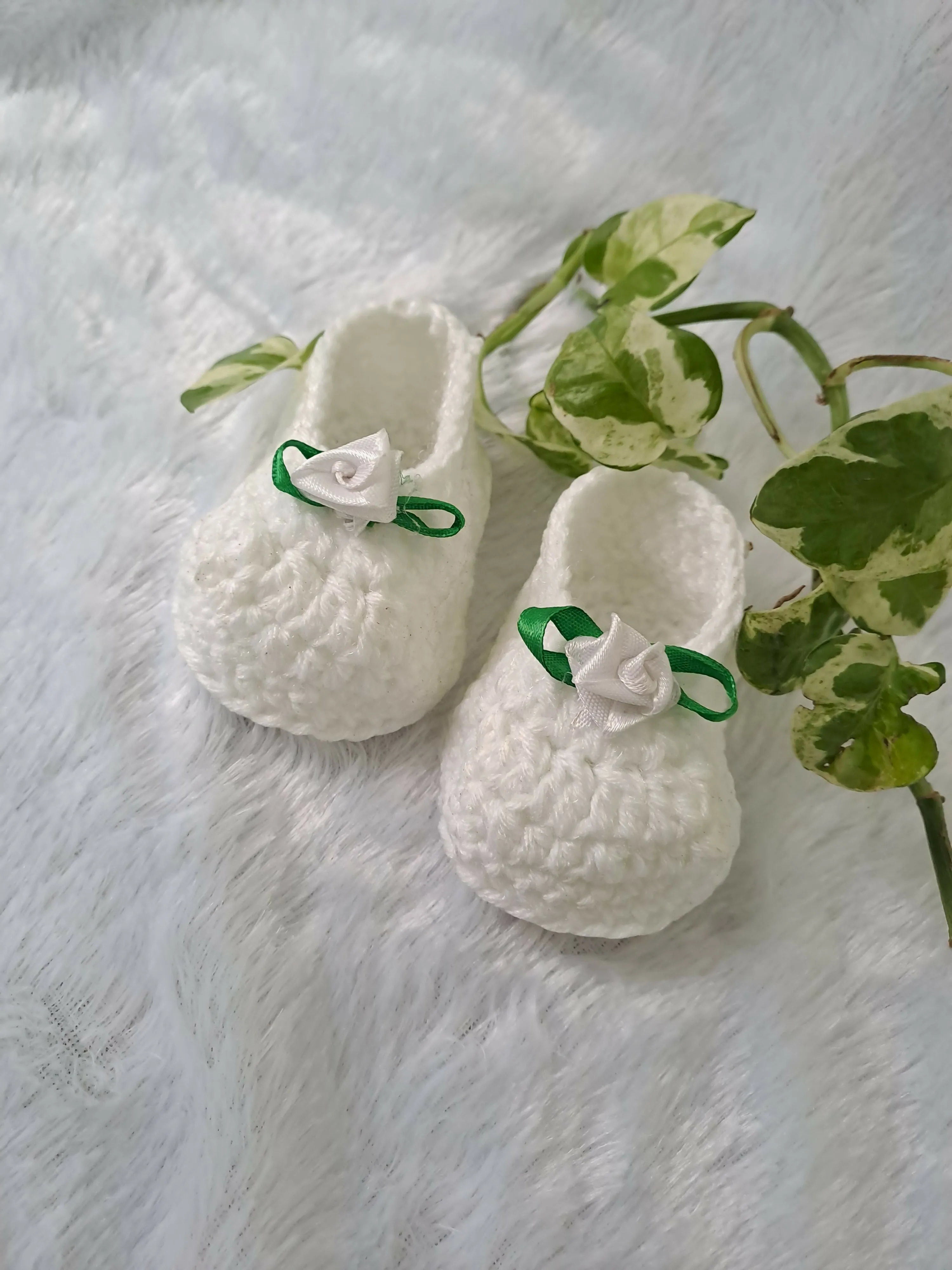 Crochet baby girl booties.