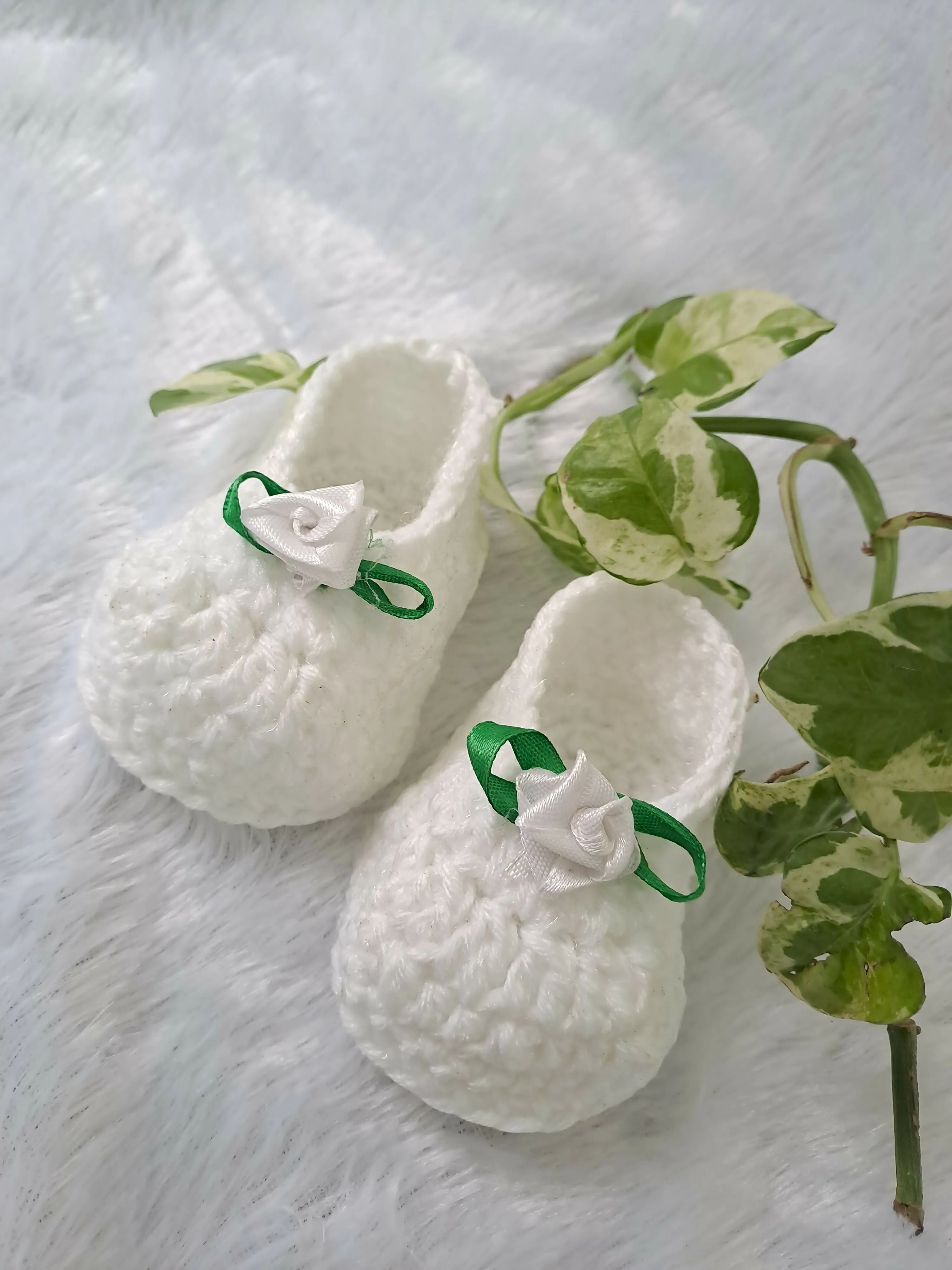 Crochet baby girl booties.